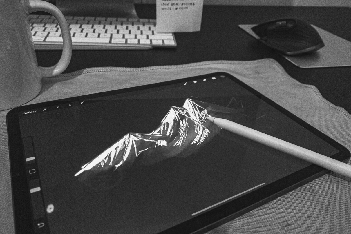 Graphic tablet with picture of mountain on screen